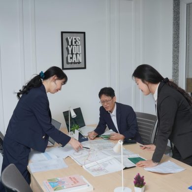 A team discussing plans in a modern office.